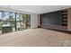 Bedroom featuring dark built-in wall units, and a large window with a view at 2536 Brawley School Rd, Mooresville, NC 28117