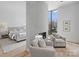 Bedroom showcasing a modern fireplace, seating area, and a glimpse of the Primary suite at 2536 Brawley School Rd, Mooresville, NC 28117