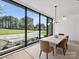 Bright dining room with oversized windows and modern lighting fixtures at 2536 Brawley School Rd, Mooresville, NC 28117