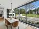 Bright dining room showcasing large picture windows with a view to the front yard and garden at 2536 Brawley School Rd, Mooresville, NC 28117
