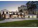 Stunning modern home with clean lines, stone accents, and a meticulously landscaped front yard at 2536 Brawley School Rd, Mooresville, NC 28117