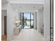 Bright foyer with lake view, tile flooring, and modern decor at 2536 Brawley School Rd, Mooresville, NC 28117