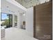 Spacious entry with lake views, high ceilings, and modern accents at 2536 Brawley School Rd, Mooresville, NC 28117