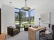 Bright home office featuring large windows, comfortable seating, and modern decor at 2536 Brawley School Rd, Mooresville, NC 28117