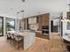 Spacious kitchen with a long island, modern appliances, and access to the staircase at 2536 Brawley School Rd, Mooresville, NC 28117
