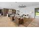 Open-concept living room with hardwood floors and stylish furniture at 2536 Brawley School Rd, Mooresville, NC 28117