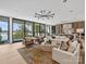 Bright living room with lake views, hardwood floors, and contemporary furnishings at 2536 Brawley School Rd, Mooresville, NC 28117