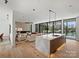 Open-concept living space combining a modern kitchen and a cozy living room with lake views at 2536 Brawley School Rd, Mooresville, NC 28117