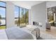 Main bedroom with scenic lake view and fireplace, offering an inviting retreat at 2536 Brawley School Rd, Mooresville, NC 28117