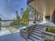 Outdoor pool with a patio, and an outdoor kitchen overlooking the lake at 2536 Brawley School Rd, Mooresville, NC 28117