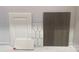 Selection of finishes: white cabinet door, white countertop sample, grey tile backsplash, and wood flooring sample at 344 Catawba Ave, Davidson, NC 28036