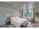 Serene bedroom featuring wood-look floors, natural light, and neutral decor, creating a peaceful retreat at 415 E Richland St, Kershaw, SC 29067