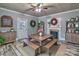 Charming dining room boasting a wooden table and benches, complimented by wood-look floors and fireplace at 415 E Richland St, Kershaw, SC 29067