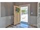 Welcoming entryway features a decorated front door opening to the home's exterior at 415 E Richland St, Kershaw, SC 29067