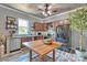 Spacious kitchen with ample counter space, dark wood cabinets, stainless steel appliances, and an island prep table at 415 E Richland St, Kershaw, SC 29067