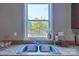 Kitchen sink with a window offering natural light and views of the outside, with granite countertops at 415 E Richland St, Kershaw, SC 29067