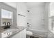 Bathroom featuring granite vanity with dark fixtures, tub, and tile flooring at 425 Messner St, Salisbury, NC 28144