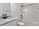 A close up of a bathroom with marble countertop vanity and tub/shower combo at 425 Messner St, Salisbury, NC 28144