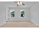 Spacious bedroom with a fan, neutral carpet and dual windows that allow for lots of natural light at 425 Messner St, Salisbury, NC 28144