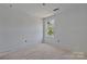 Minimalist bedroom design featuring a bright window and fresh paint at 425 Messner St, Salisbury, NC 28144