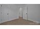 Neutral bedroom showing door and modern fixtures at 425 Messner St, Salisbury, NC 28144