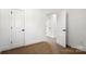 Bedroom with neutral carpet, white walls, and bright white doors leading to other rooms at 425 Messner St, Salisbury, NC 28144