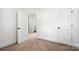Bedroom with neutral carpet, white walls, and bright white doors leading to other rooms at 425 Messner St, Salisbury, NC 28144