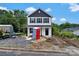 Charming two-story home with black and white exterior paint, black window shutters, and landscaping to be finished at 425 Messner St, Salisbury, NC 28144