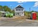 New two-story home with white siding and black accents sits ready for landscaping at 425 Messner St, Salisbury, NC 28144