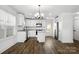 Modern kitchen featuring white cabinetry, stainless steel appliances, and a stylish island at 425 Messner St, Salisbury, NC 28144