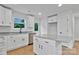 Bright kitchen features white cabinets, granite countertops, stainless appliances, and a kitchen island at 425 Messner St, Salisbury, NC 28144