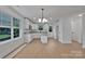 Bright kitchen features white cabinets, granite countertops, stainless appliances, and light-colored flooring at 425 Messner St, Salisbury, NC 28144