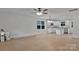 Bright open concept kitchen with white cabinets, granite countertops, stainless appliances, and center island at 425 Messner St, Salisbury, NC 28144