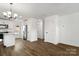 Open concept area with a view from the living room into the modern kitchen with stainless appliances at 425 Messner St, Salisbury, NC 28144