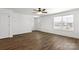 Inviting living room with a ceiling fan, large windows, and beautiful hardwood flooring at 425 Messner St, Salisbury, NC 28144