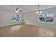 Spacious living room with light hardwood floors and large windows allowing lots of natural light at 425 Messner St, Salisbury, NC 28144
