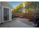 Cozy backyard featuring a brick patio, wood fence, and comfortable seating, perfect for outdoor relaxation at 4507 Antelope Ln, Charlotte, NC 28269