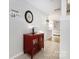 Charming entryway with a decorative mirror, stylish red cabinet, and tile flooring at 4507 Antelope Ln, Charlotte, NC 28269