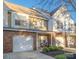 Charming townhome featuring a brick facade, single-car garage, manicured front yard, and inviting entrance at 4507 Antelope Ln, Charlotte, NC 28269