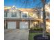 Charming townhome featuring a brick facade, single-car garage, manicured front yard, and inviting entrance at 4507 Antelope Ln, Charlotte, NC 28269
