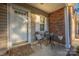 Inviting front porch featuring a seating area, decorative welcome mat, and elegant white door at 4507 Antelope Ln, Charlotte, NC 28269