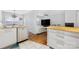 Bright kitchen features stainless steel dishwasher, sink with stainless steel faucet and butcher block countertops at 4507 Antelope Ln, Charlotte, NC 28269