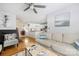 Bright living room with hardwood floors, modern decor, and a seamless view into the adjacent kitchen at 4507 Antelope Ln, Charlotte, NC 28269