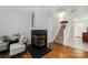 Inviting living room showcases a stylish fireplace and staircase with carpeted steps at 4507 Antelope Ln, Charlotte, NC 28269