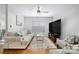 Spacious living room with hardwood floors, a ceiling fan, and lots of natural light at 4507 Antelope Ln, Charlotte, NC 28269