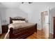 Spacious main bedroom features neutral walls, wood furniture, and hardwood floors at 4507 Antelope Ln, Charlotte, NC 28269