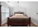 Bright main bedroom features neutral walls, hardwood floors and a large window at 4507 Antelope Ln, Charlotte, NC 28269