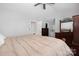 Large main bedroom has hardwood floors, ceiling fan, and ensuite bathroom at 4507 Antelope Ln, Charlotte, NC 28269