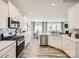 Bright kitchen with stainless steel appliances, white cabinets, and open concept layout at 4625 Potters Wheel Dr, Fort Mill, SC 29715