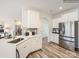 Well-lit kitchen featuring stainless steel appliances, white cabinets, and quartz countertops at 4625 Potters Wheel Dr, Fort Mill, SC 29715